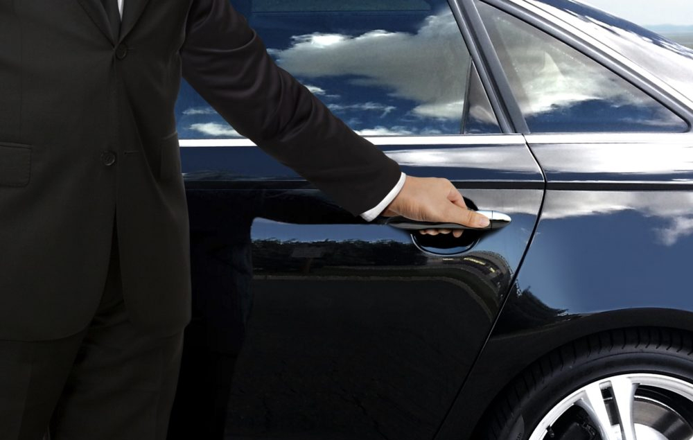 Chauffeur opening car door