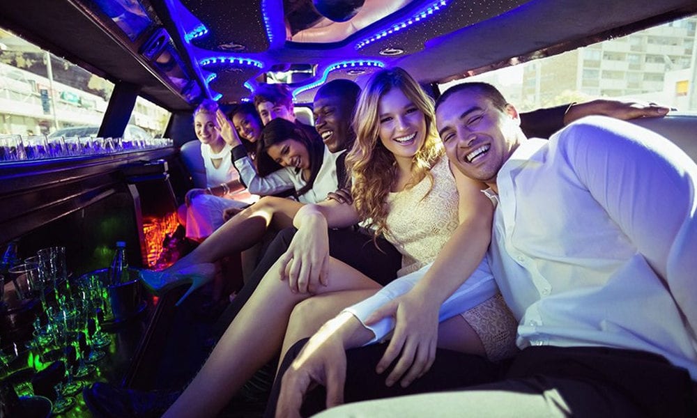 Group gathering in stretch limo