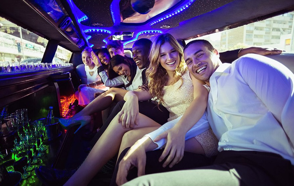 Group gathering in stretch limo