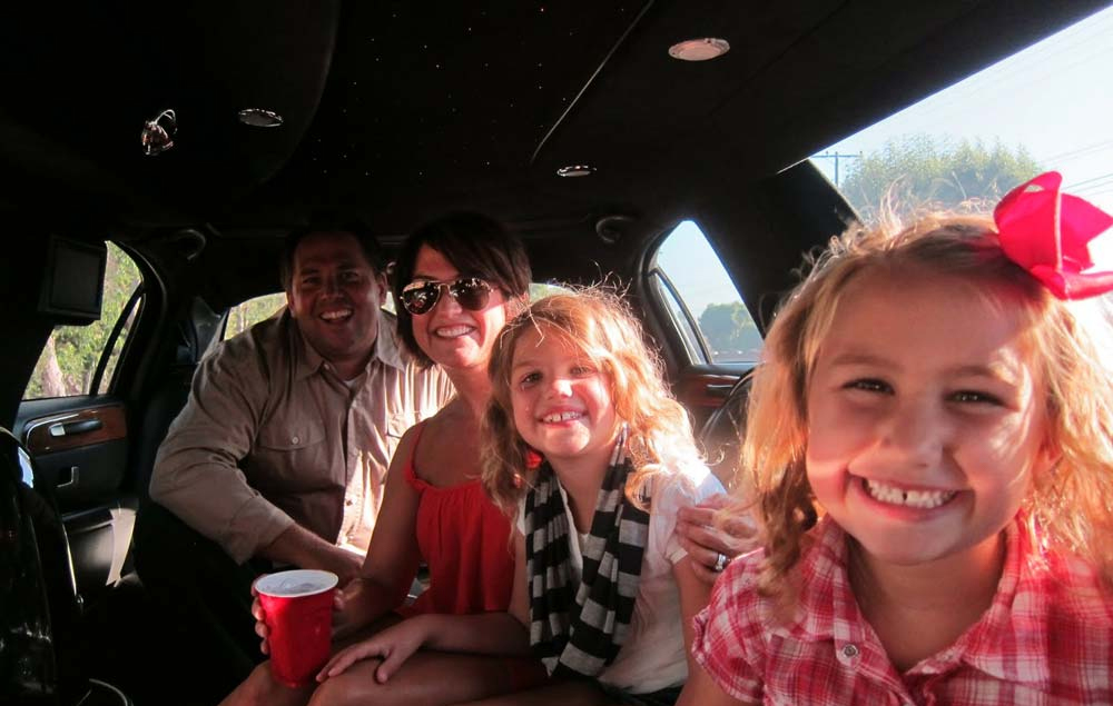 Family riding in limo